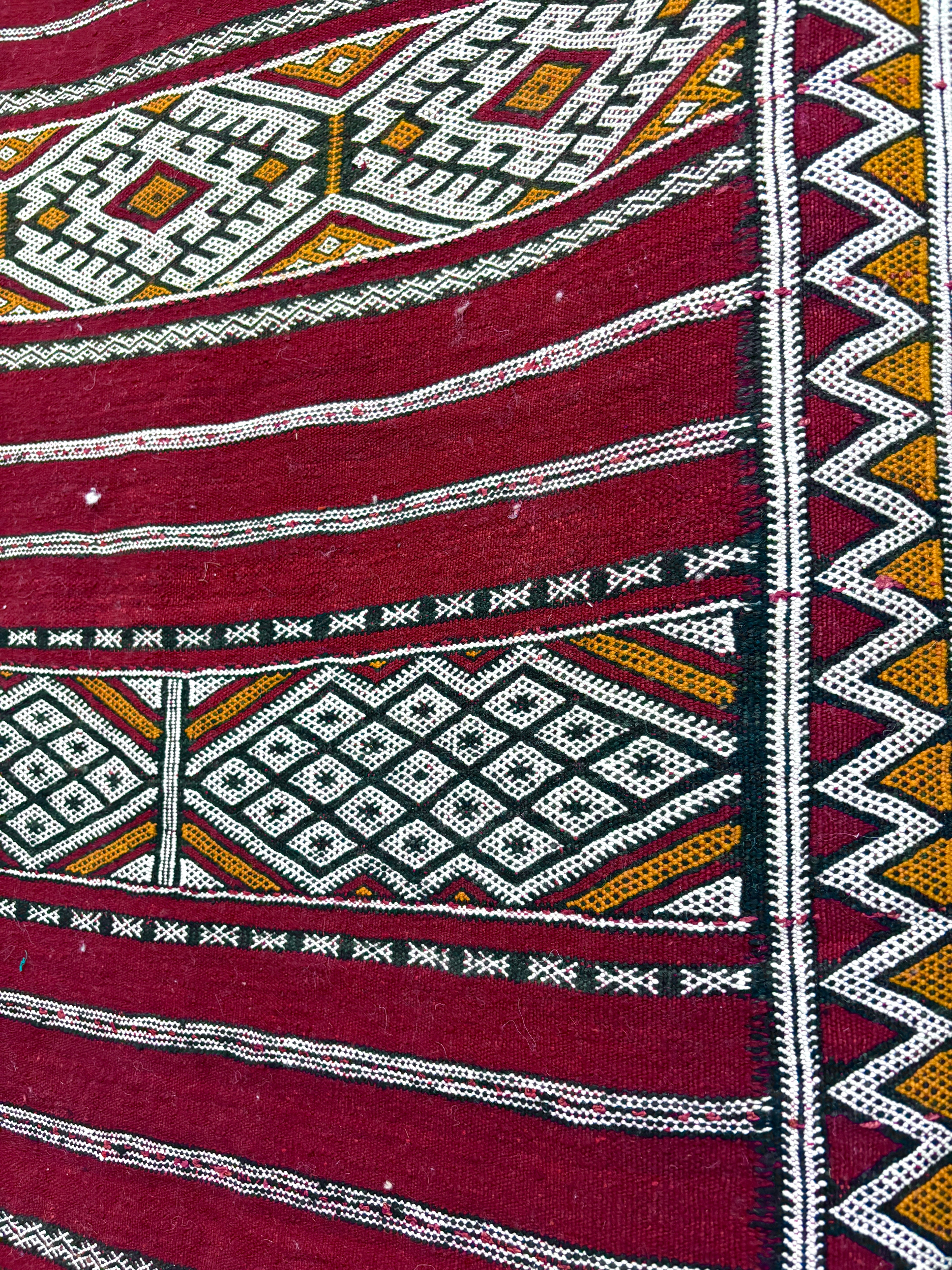 Vintage Zemmour Moroccan Kilim with Crimson Field and Bordered Diamond Bands