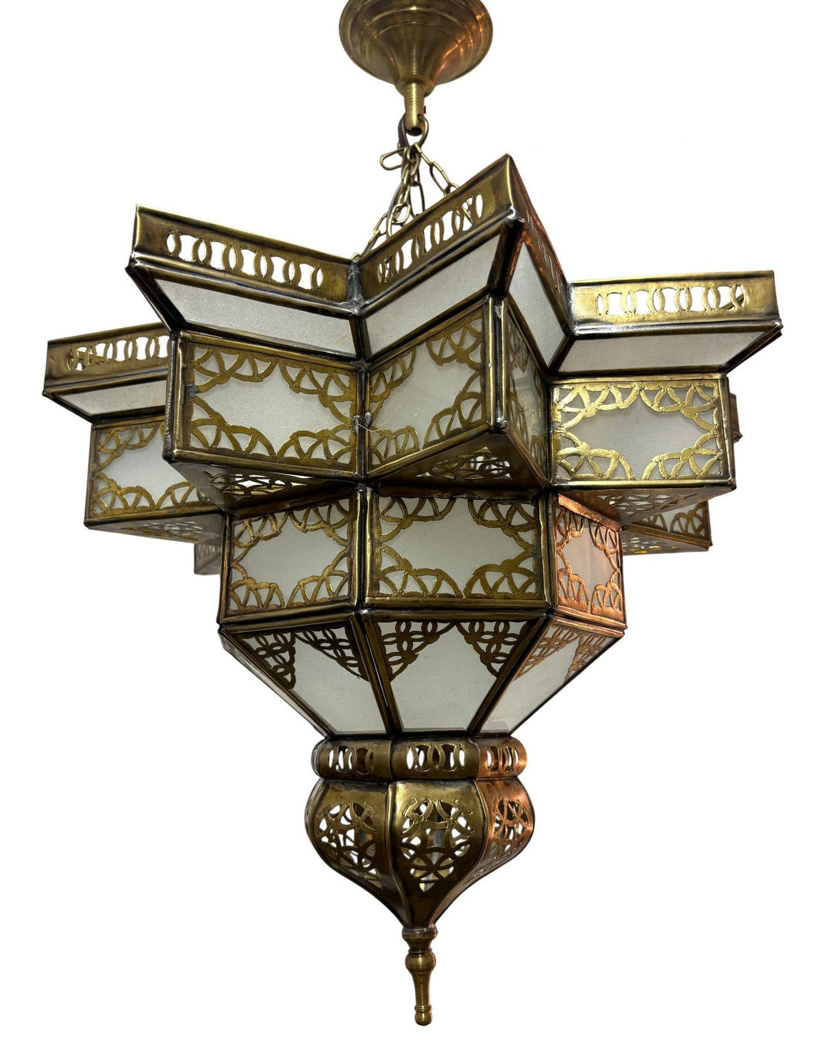 An ornate geometric brass pendant chandelier with multiple tiers of white frosted glass panels and intricate brass filigree detailing, shown against a plain white background.