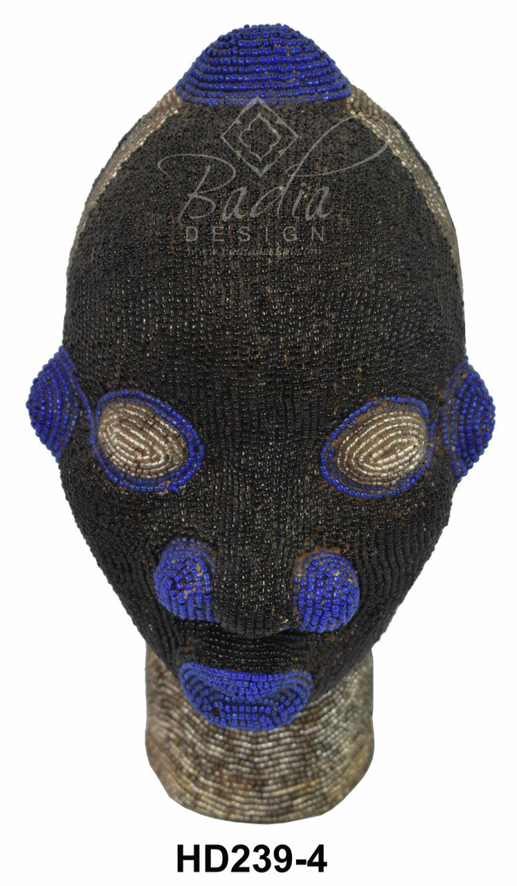 Black beaded head with blue accents on a mannequin head