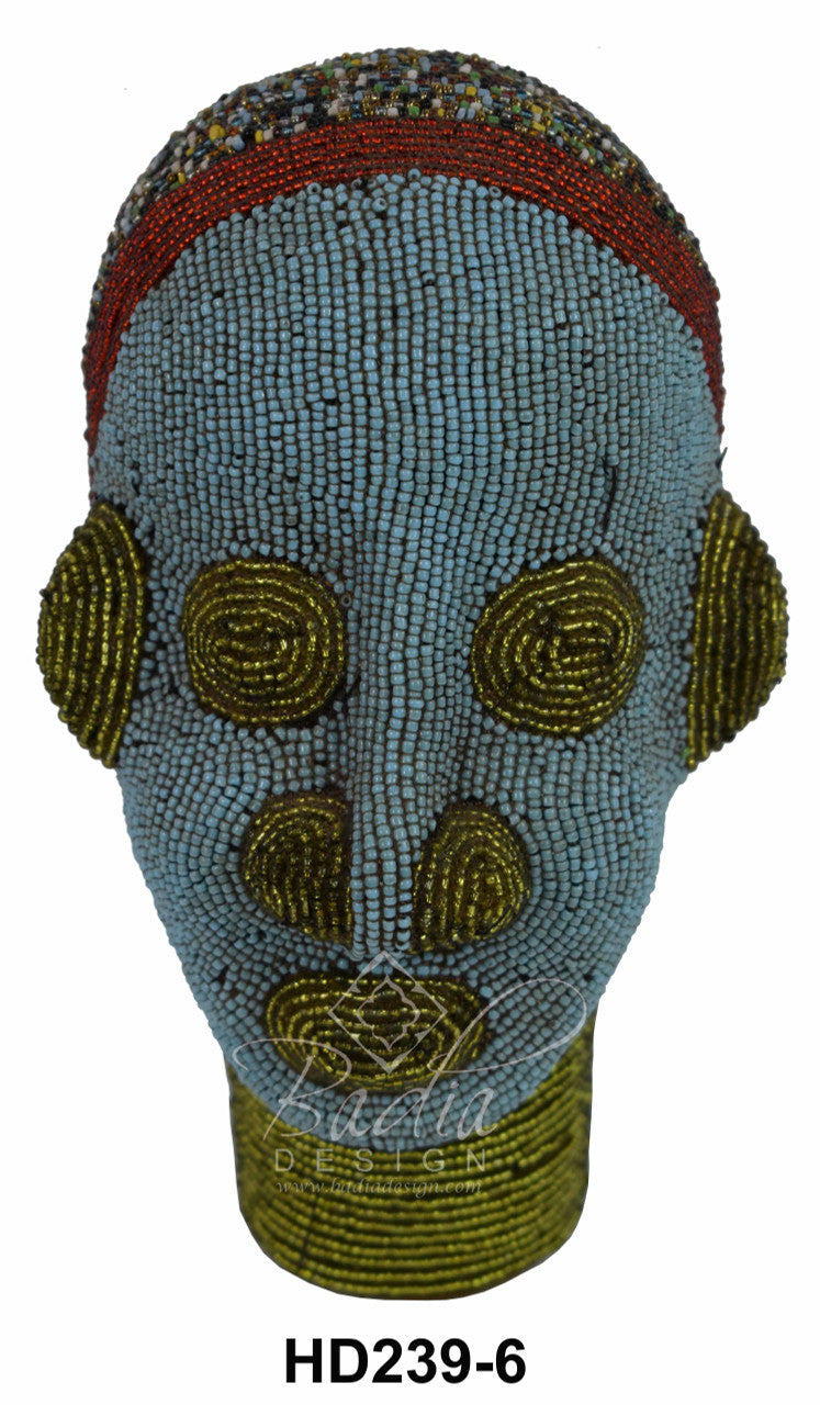 Decorative beaded head with beadwork on a white background