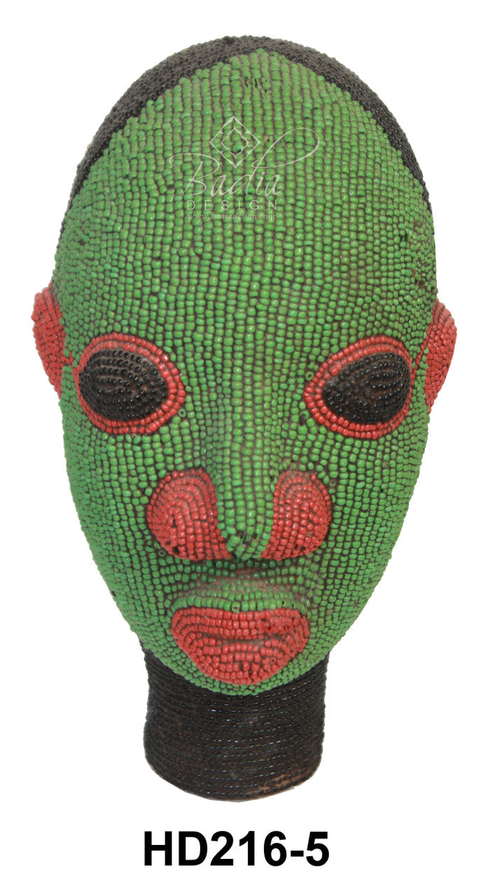 Green and red beaded mask with black accents on a white background