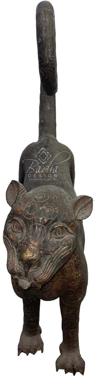 Large antique Bronze saber-tooth sculpture in a standing front view position.