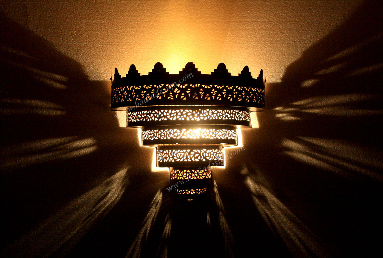 Decorative wall light casting shadows on a wall
