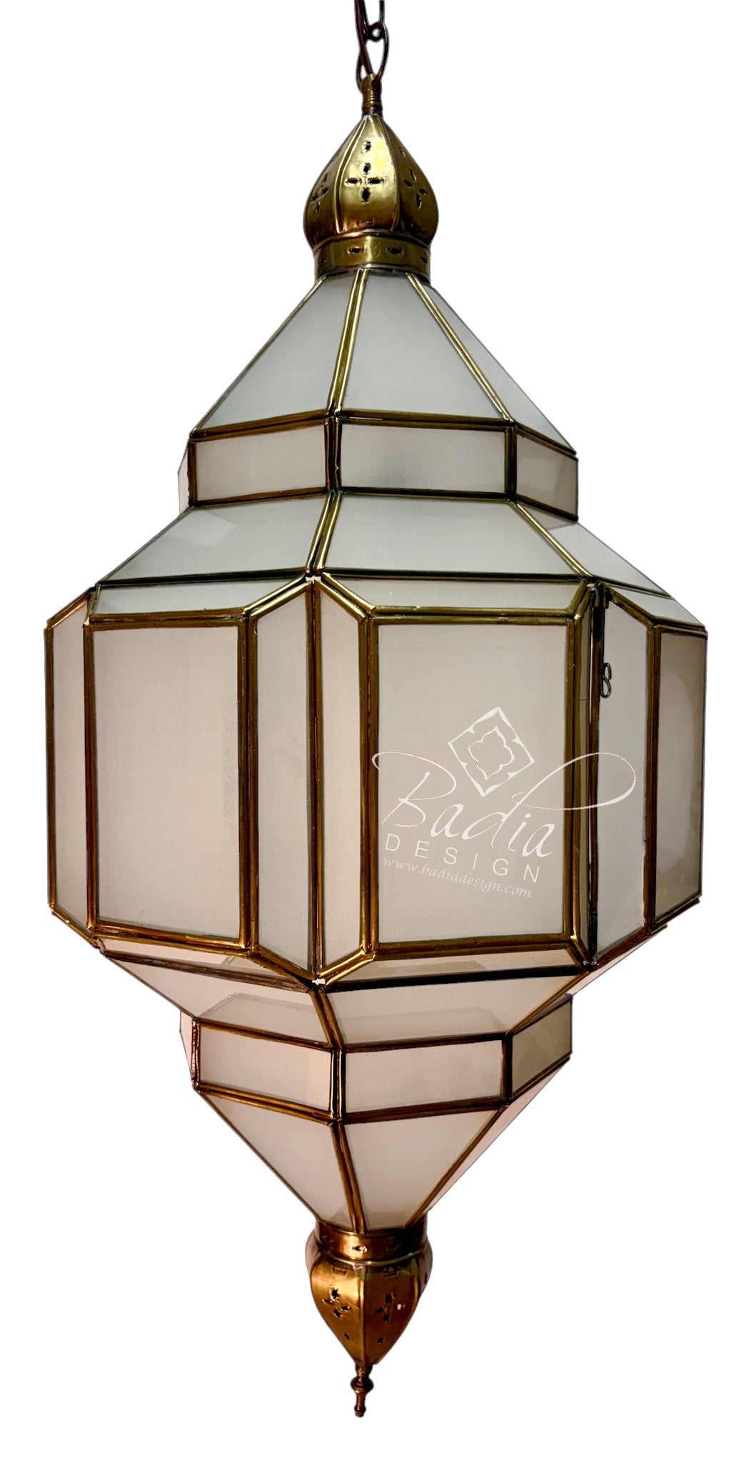A hanging lantern-style pendant light with geometric glass panels and brass-toned metal framing, shown against a plain white background. A faint &