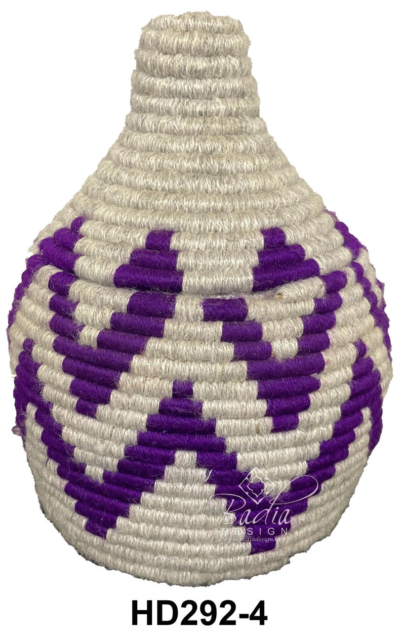Woven container with purple and white pattern on a white background