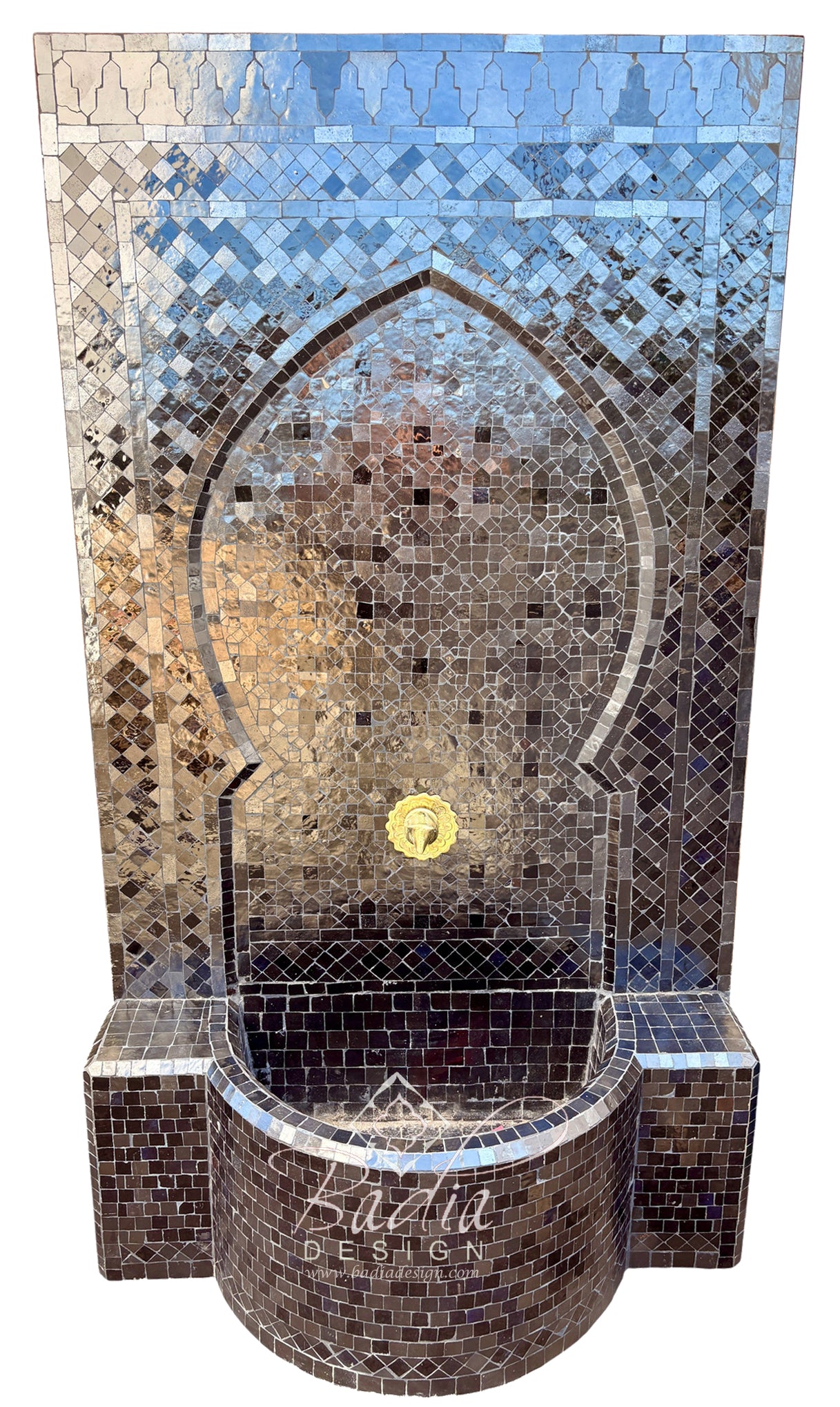 A Moorish-style mosaic fountain wall and basin made of reflective silver mirror tiles, with a small gold circular accent in the center and a visible &