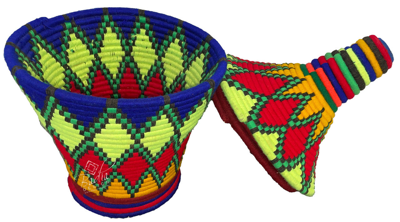 Colorful woven basket and bag with geometric patterns on a white background
