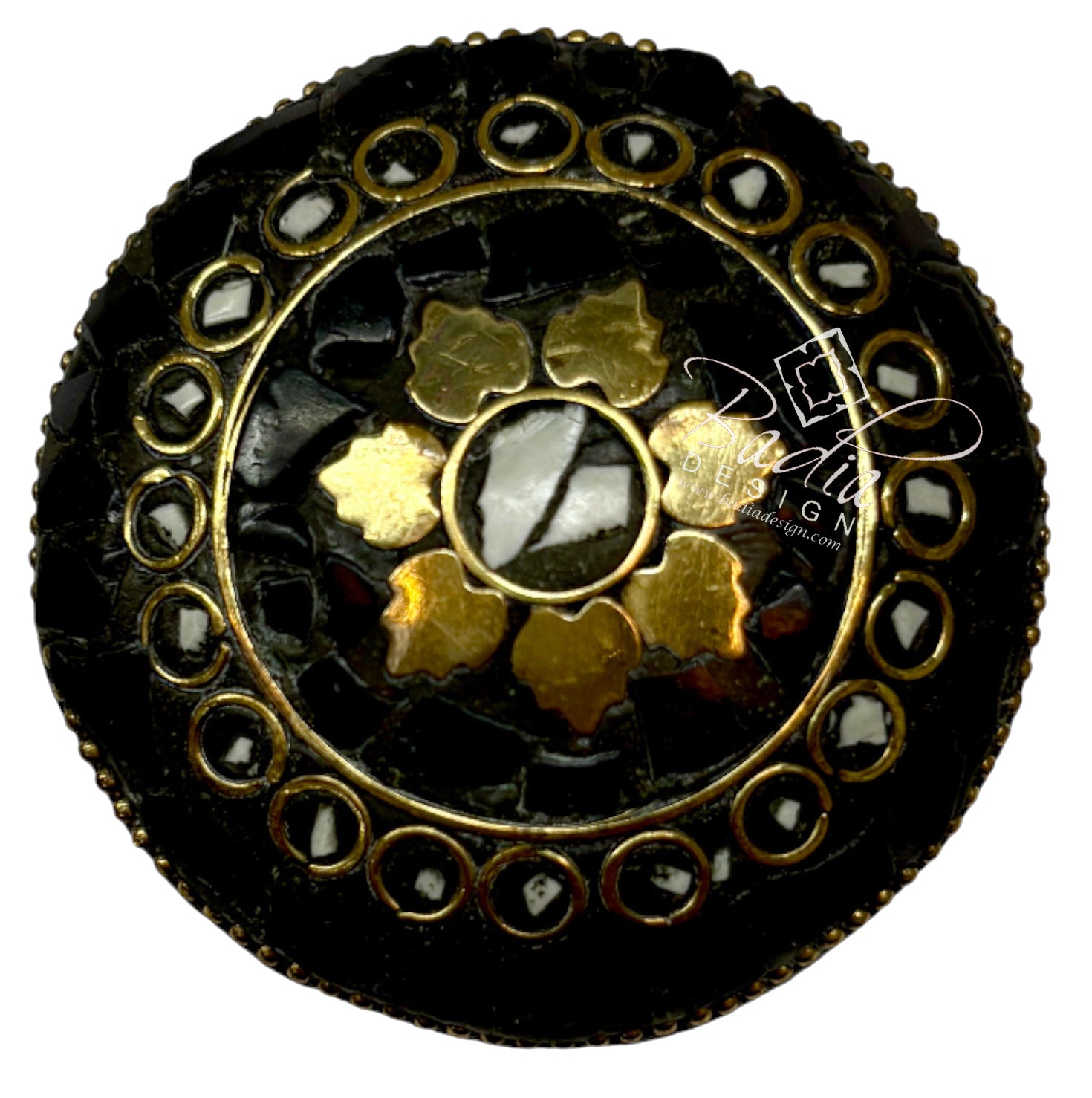 Decorative button with gold and black design top on a white background