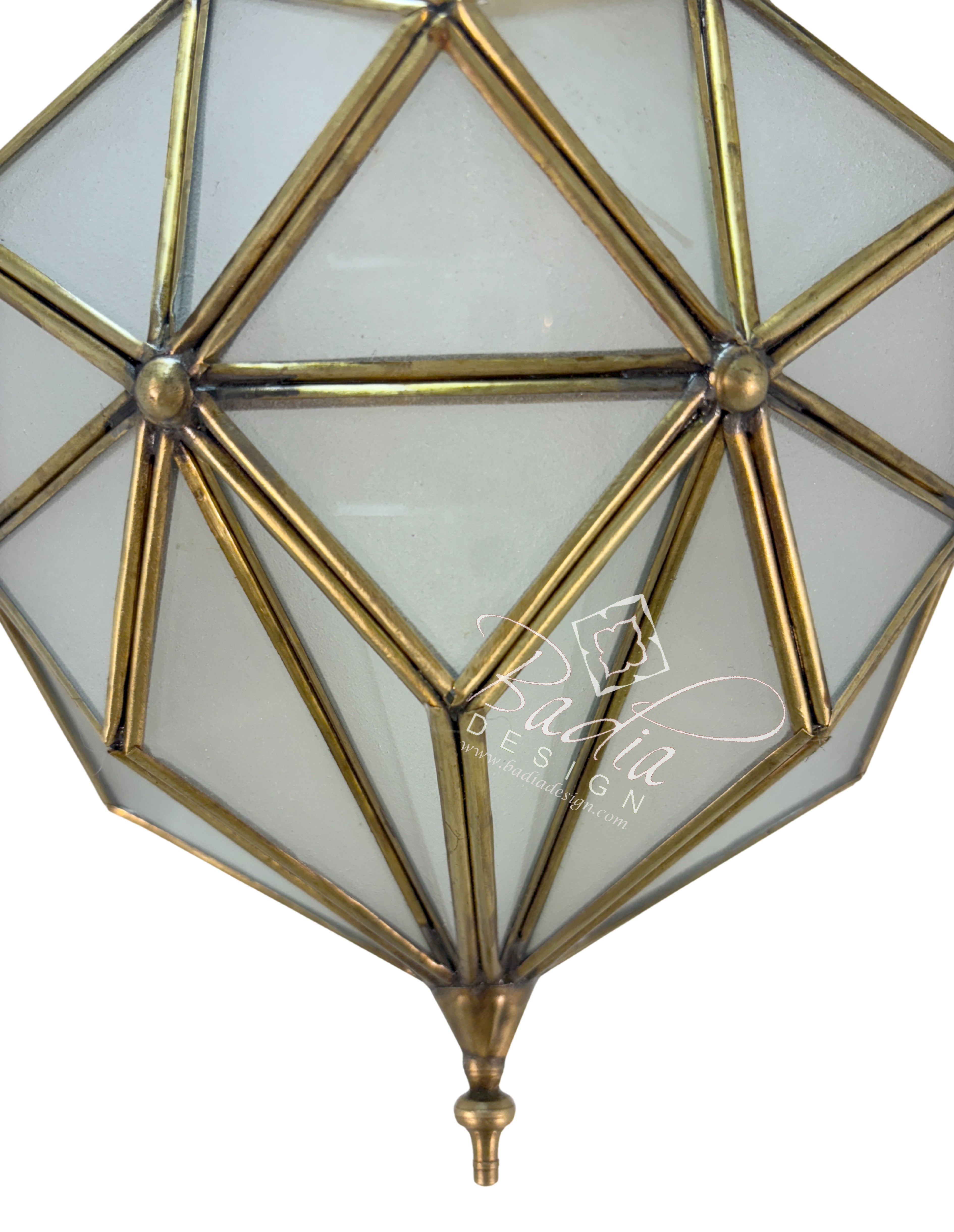 Geometric glass ceiling light fixture with brass accents on a white background