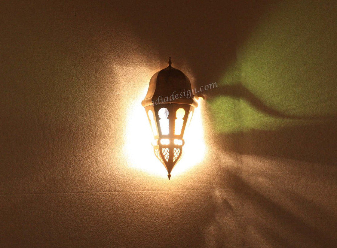 Decorative wall light fixture casting a shadow on a wall