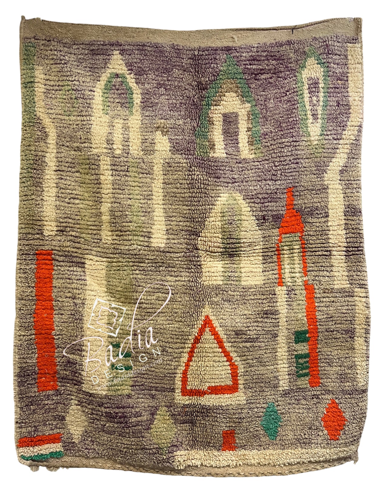 A square handwoven rug with a geometric and architectural pattern, featuring stylized domes and arches in muted purple, beige, green, and red-orange.
