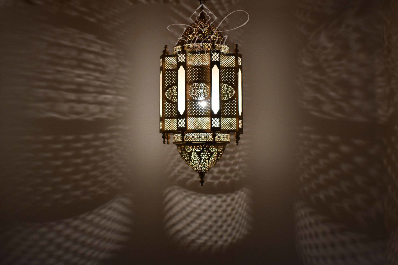 Decorative lantern casting shadows on a wall
