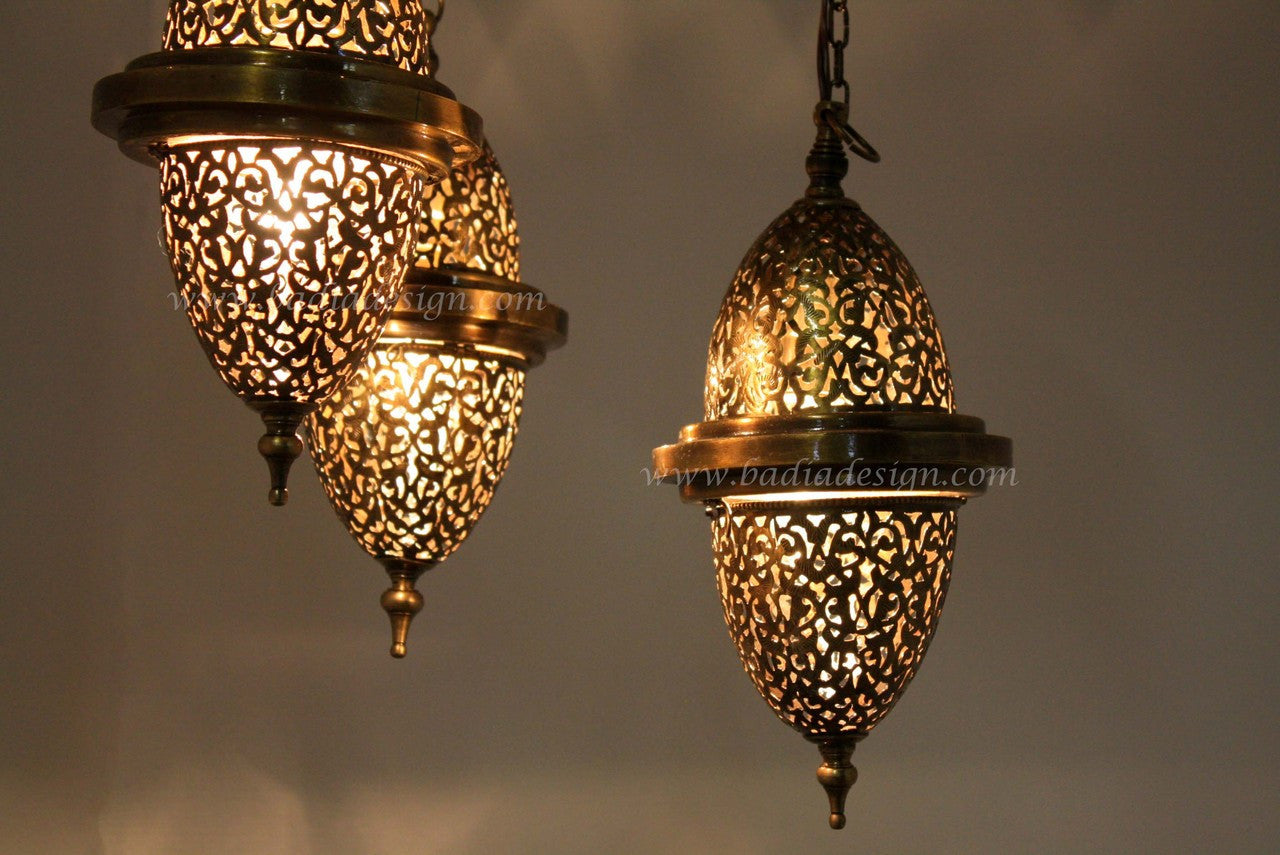 Ornate hanging lanterns with intricate designs on a gray background