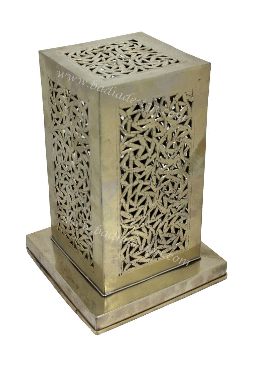 Decorative silver metal lantern with intricate cut-out patterns on a white background