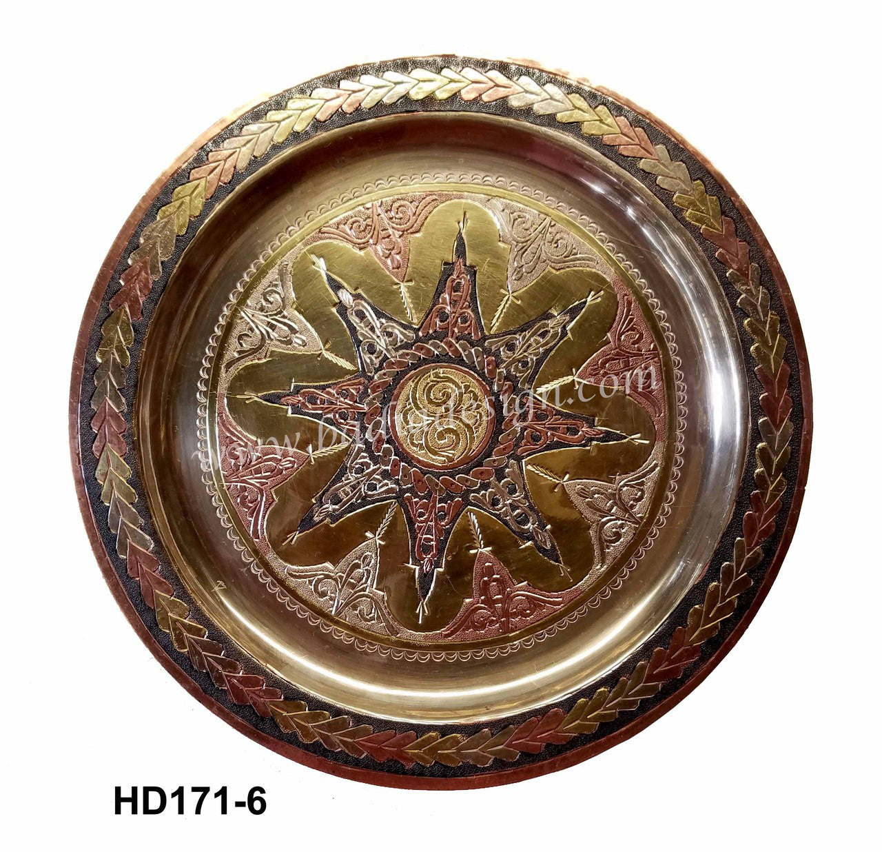 Decorative metal plate with star design and leaf patterns on a white background