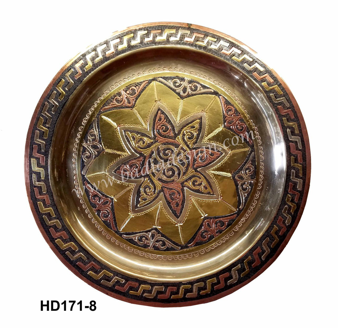 Decorative metal tray with star design and intricate border on a white background