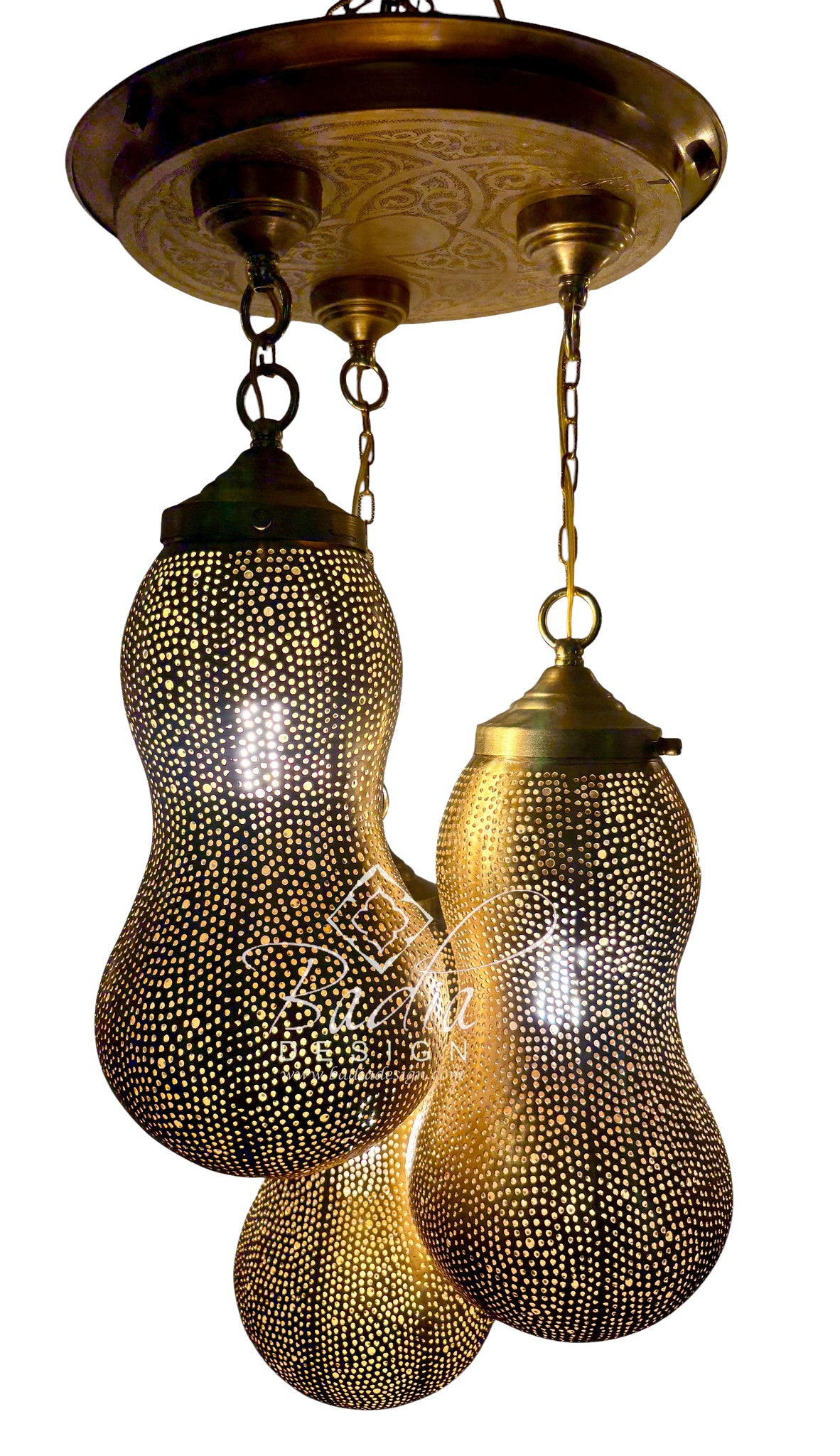 A brass three-light linear chandelier with pear-shaped glass shades covered in small metallic dots, shown against a plain white background.