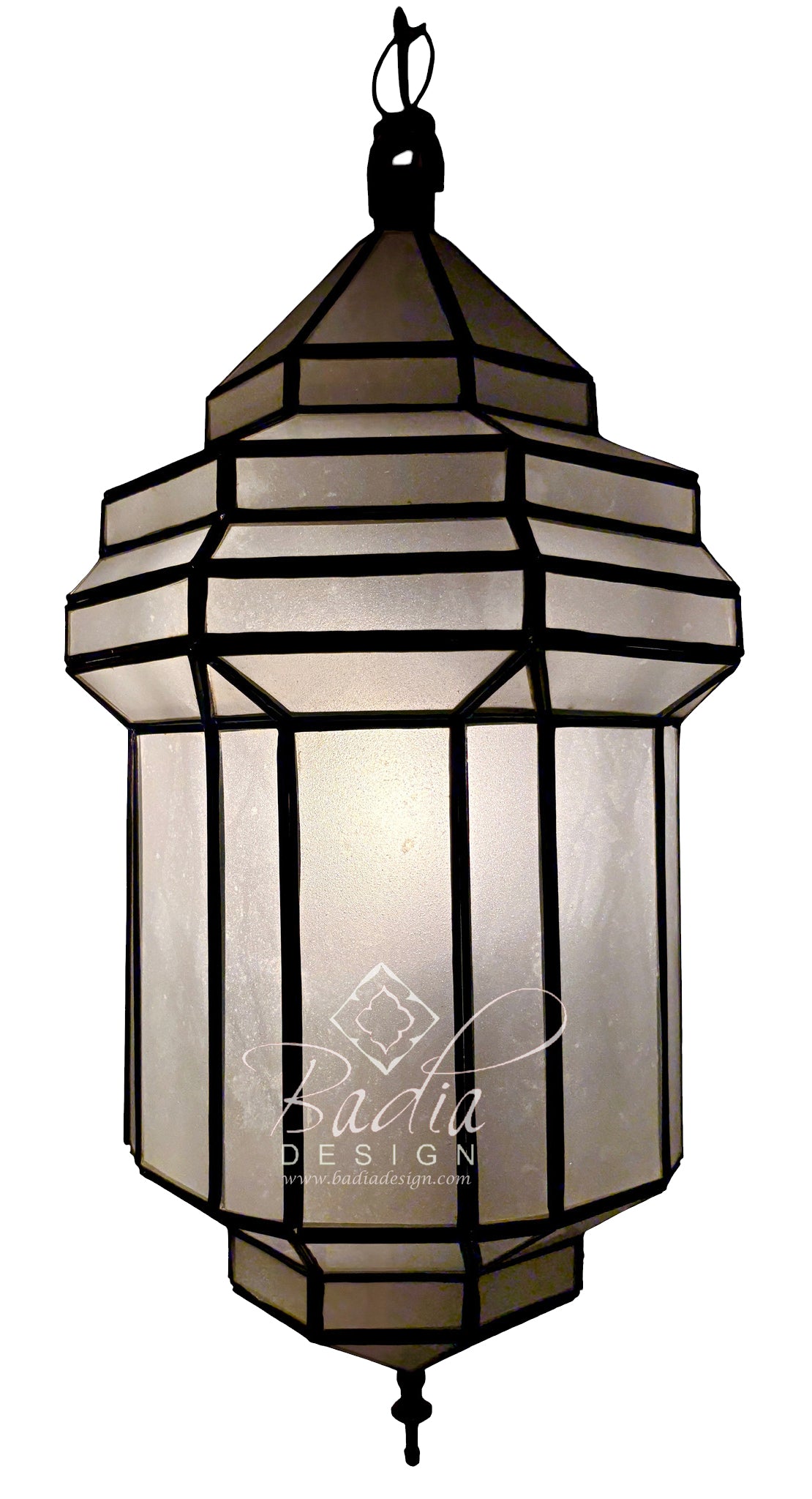 A hanging lantern-style pendant light with a black metal frame and translucent warm-toned panels, shown against a plain white background. A watermark reading &