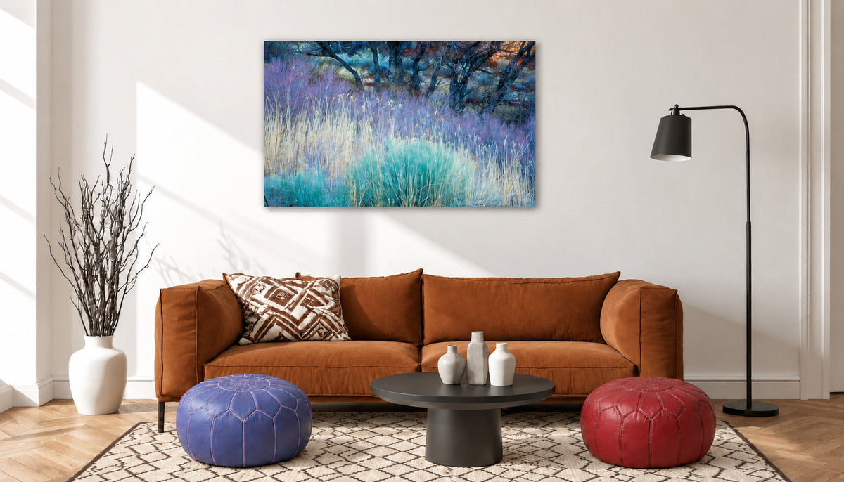 Authentic Moroccan leather poufs in a decorated living room setting with a sofa, Moroccan rug and wall painting.