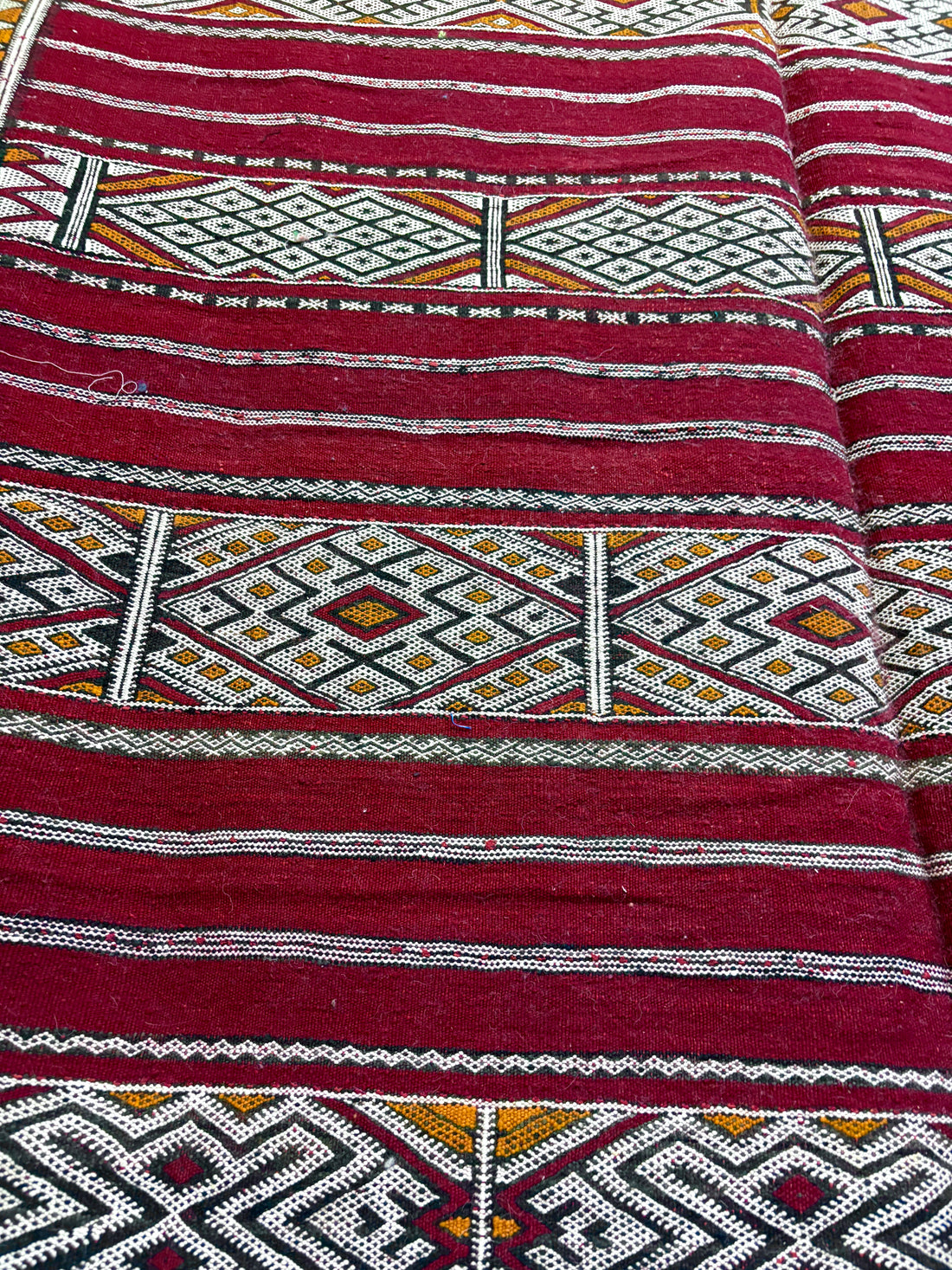 Vintage Zemmour Moroccan Kilim with Crimson Field and Bordered Diamond Bands
