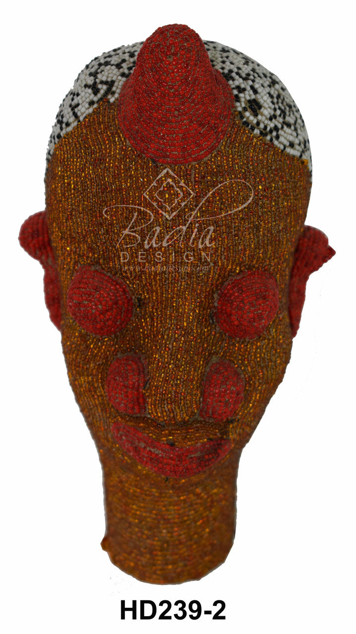 Decorative head-shaped object with red and brown colors, featuring a brand logo on a white background.