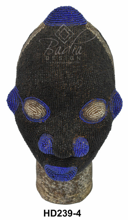 Black beaded head with blue accents on a mannequin head