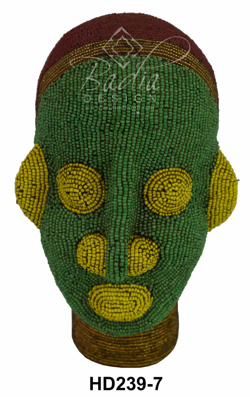 Decorative beaded gead with green and yellow patterns on a white background