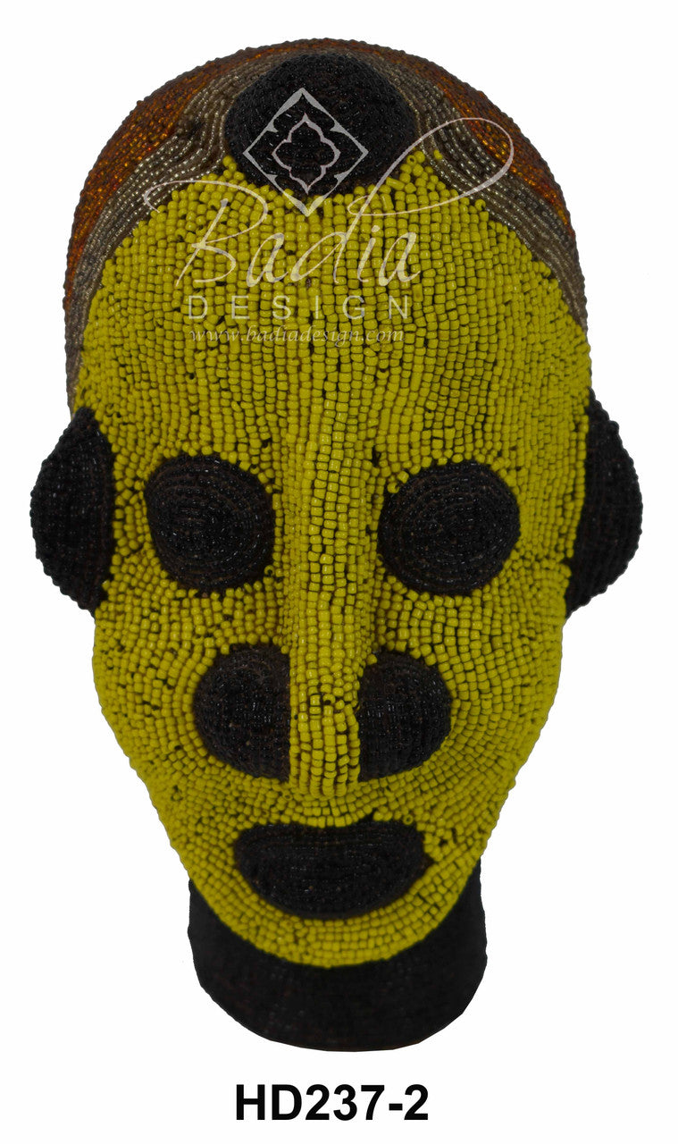 Yellow beaded head with black accents on a white background