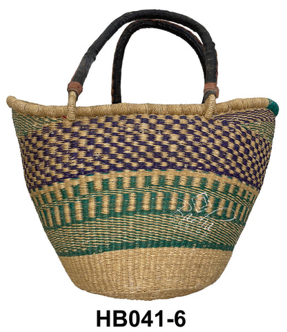 Woven raffia handbag with colorful purple and green patterns and leather handles.