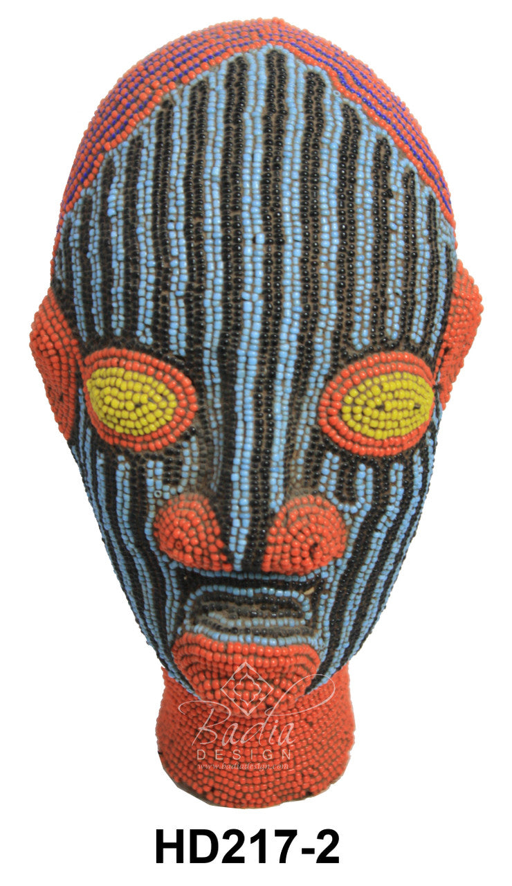 Colorful beaded head with striped pattern and orange accents on a white background