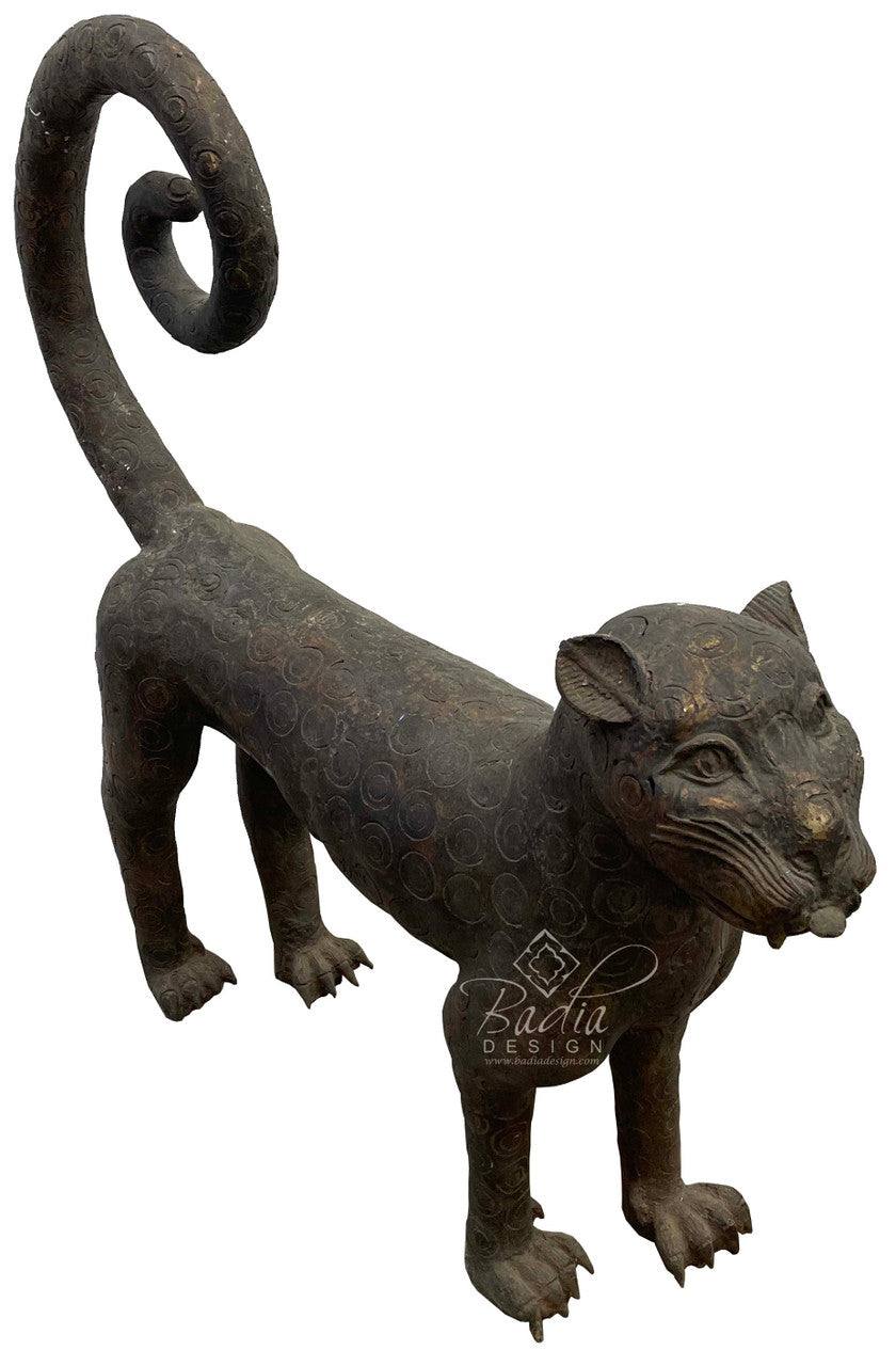 Large antique Bronze saber-tooth sculpture in a standing position.