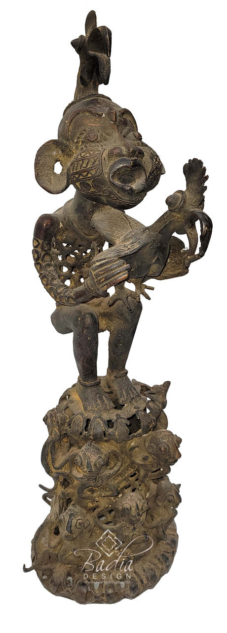 Bronze sculpture of a figure playing a lyre on a decorative base with &