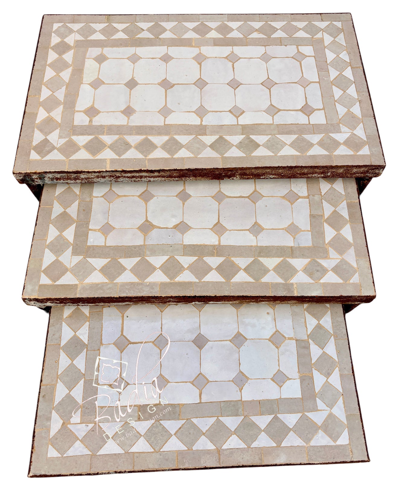 Three rectangular nesting tables stacked vertically, featuring a geometric mosaic tile pattern in beige and off-white.