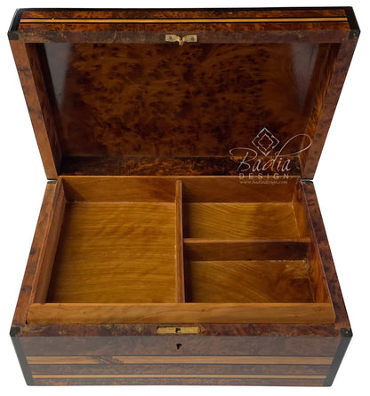Wooden jewelry box with compartments on a white background