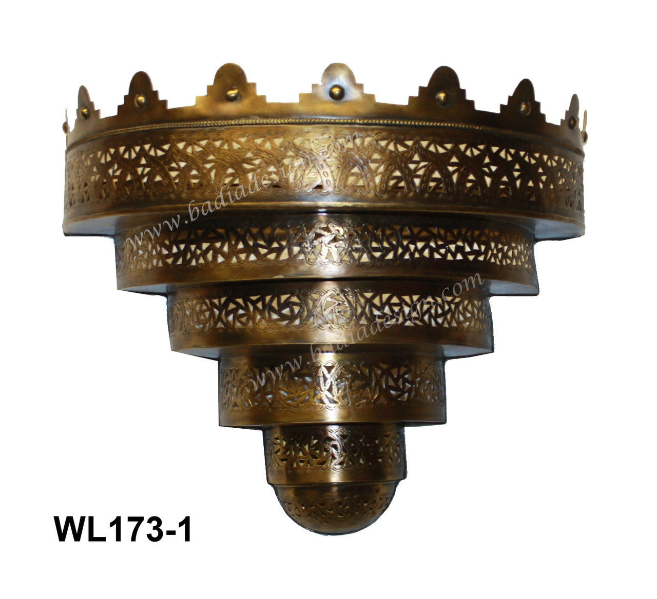 Decorative brass wall sconce with intricate patterns on a white background