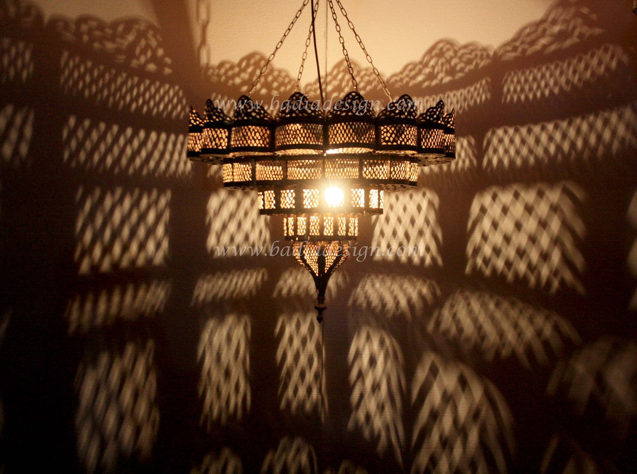 Decorative chandelier casting shadows on a wall