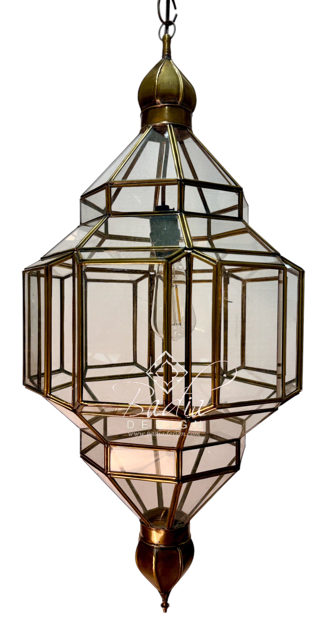 A geometric hanging pendant light with clear glass panels and brass-toned metal framing, suspended against a plain white background.