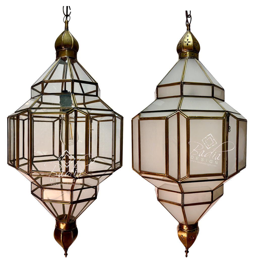 Two matching geometric hanging lantern-style pendant lights with clear glass panels and brass/gold-toned metal framing, shown side by side on a white background.
