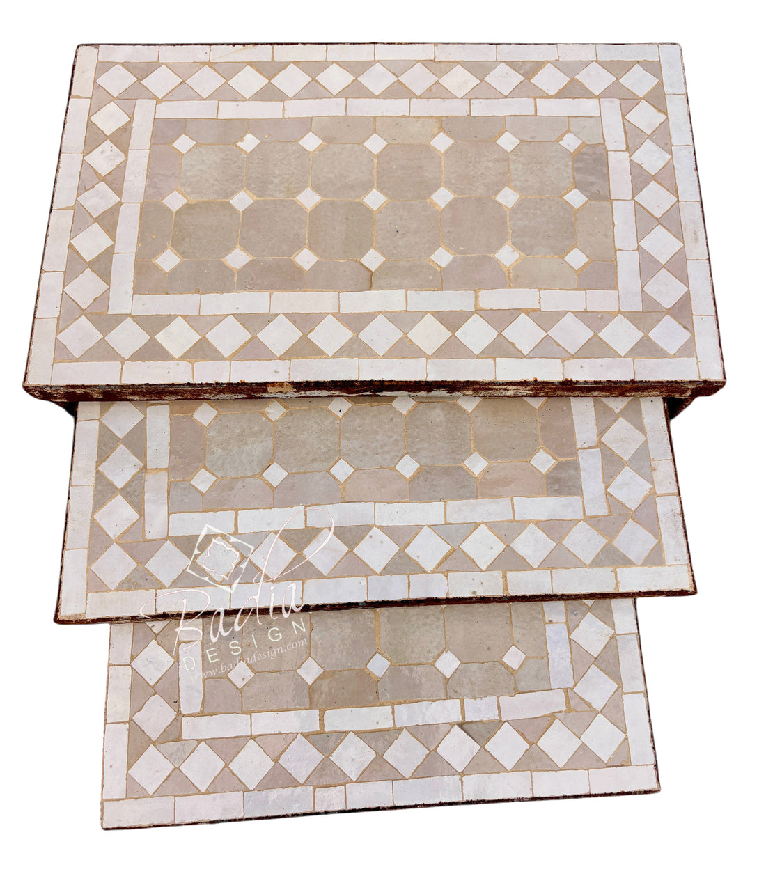Three rectangular nesting tables stacked vertically, featuring a beige and white mosaic tile design with a geometric diamond pattern.