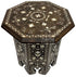 Decorative octagonal table with intricate patterns on a white background, featuring the Badia Design logo.