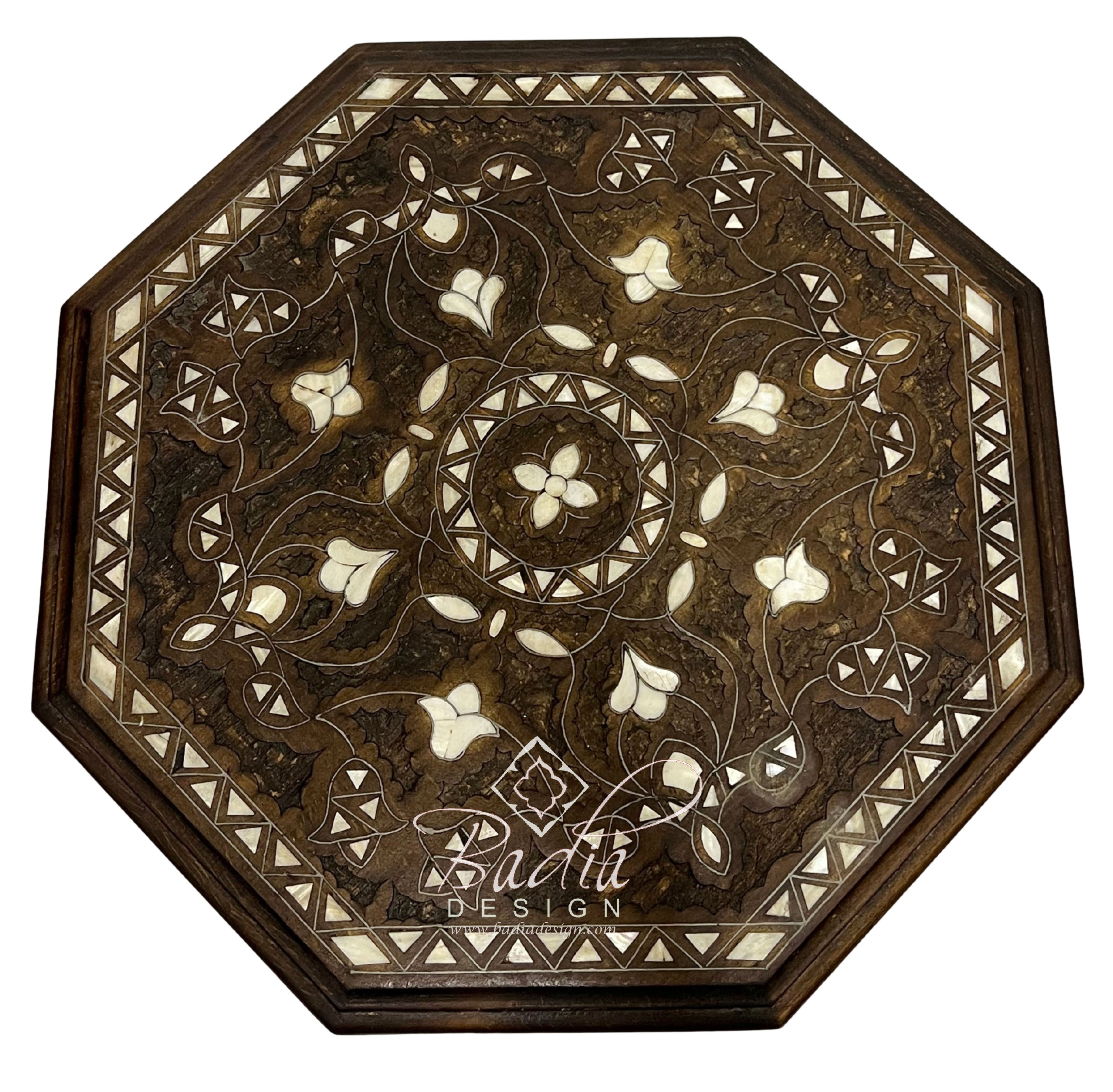 Decorative wooden table top with intricate inlay patterns on a white background