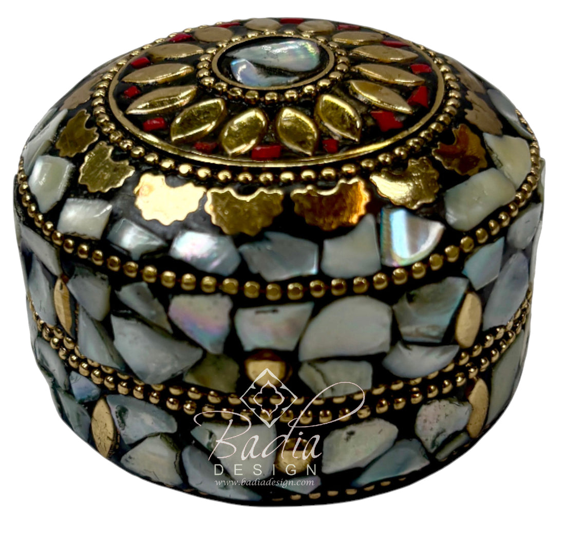 Decorative box with mosaic design and gold accents on a white background, featuring the Badiia Design logo.