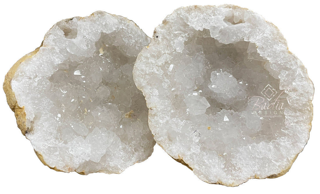 Two halves of a crystal geode on a white background with &