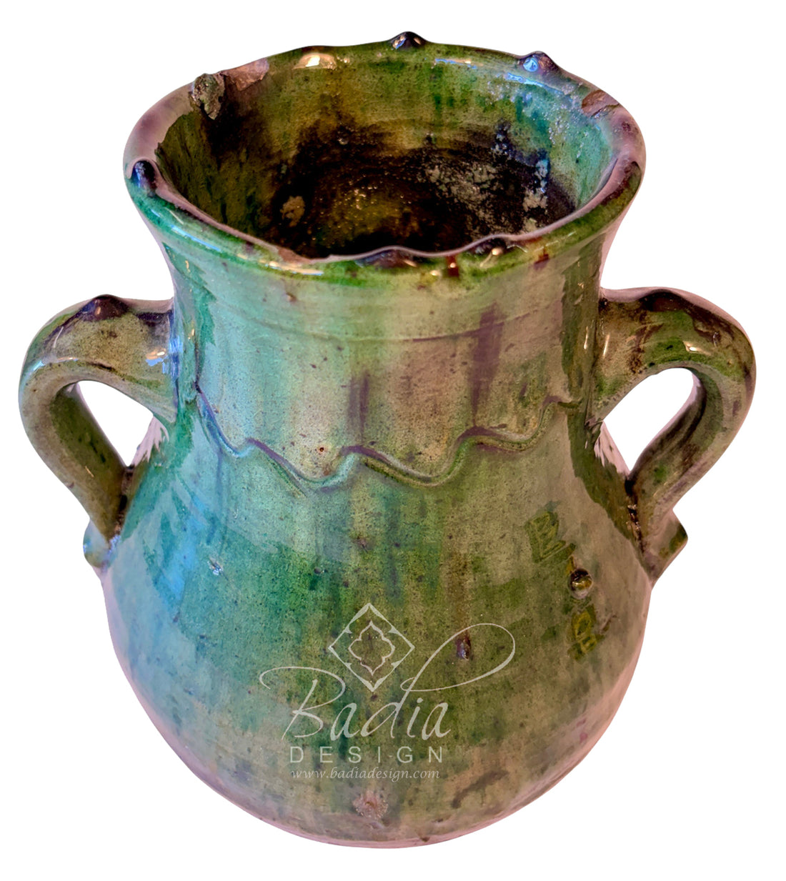 A handmade ceramic planter pot with two side handles, featuring a rustic glaze with green, blue, and brown tones, on a white background.