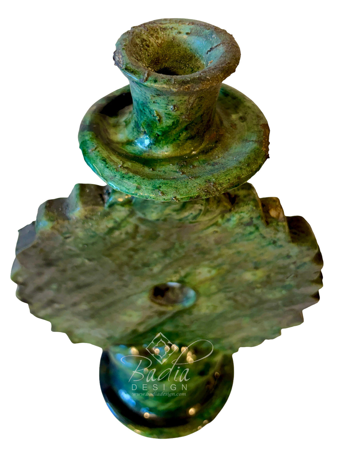 An antique-style green glazed metal candle holder with a textured, patinated finish, isolated on a white background with a &