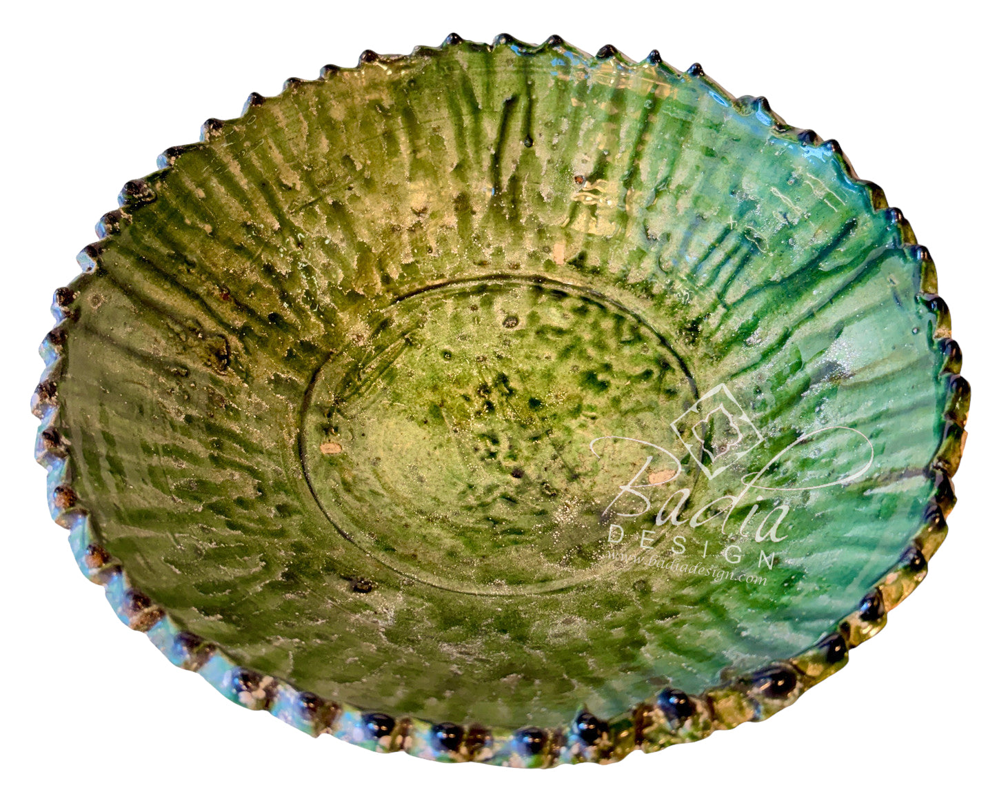 A handmade ceramic bowl with a textured, ribbed interior and a scalloped, glazed exterior featuring a blend of green, blue, and brown glazes on a white background.