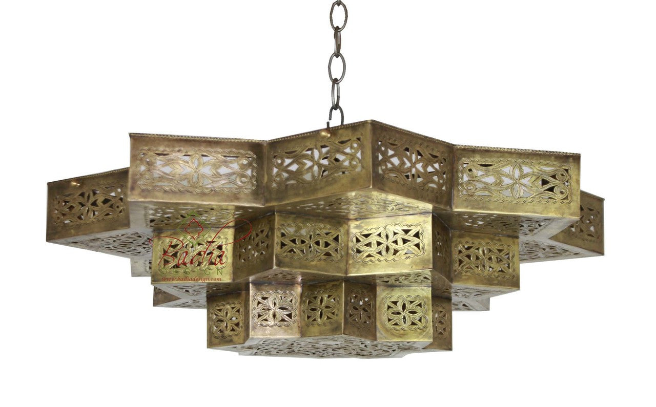 Decorative brass chandelier with intricate patterns on a white background