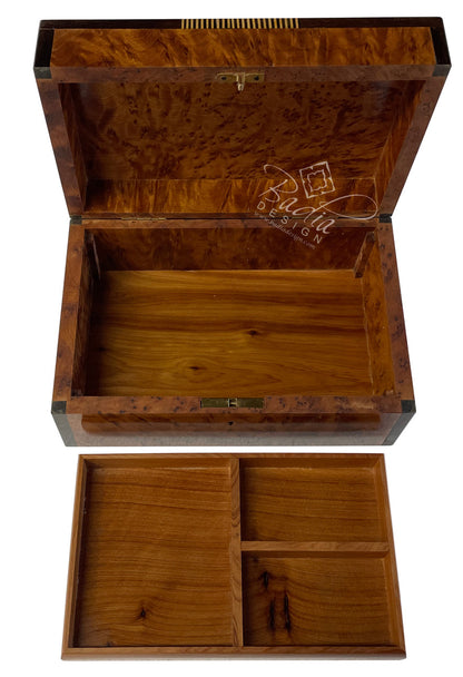 Wooden jewelry box with compartments on a white background