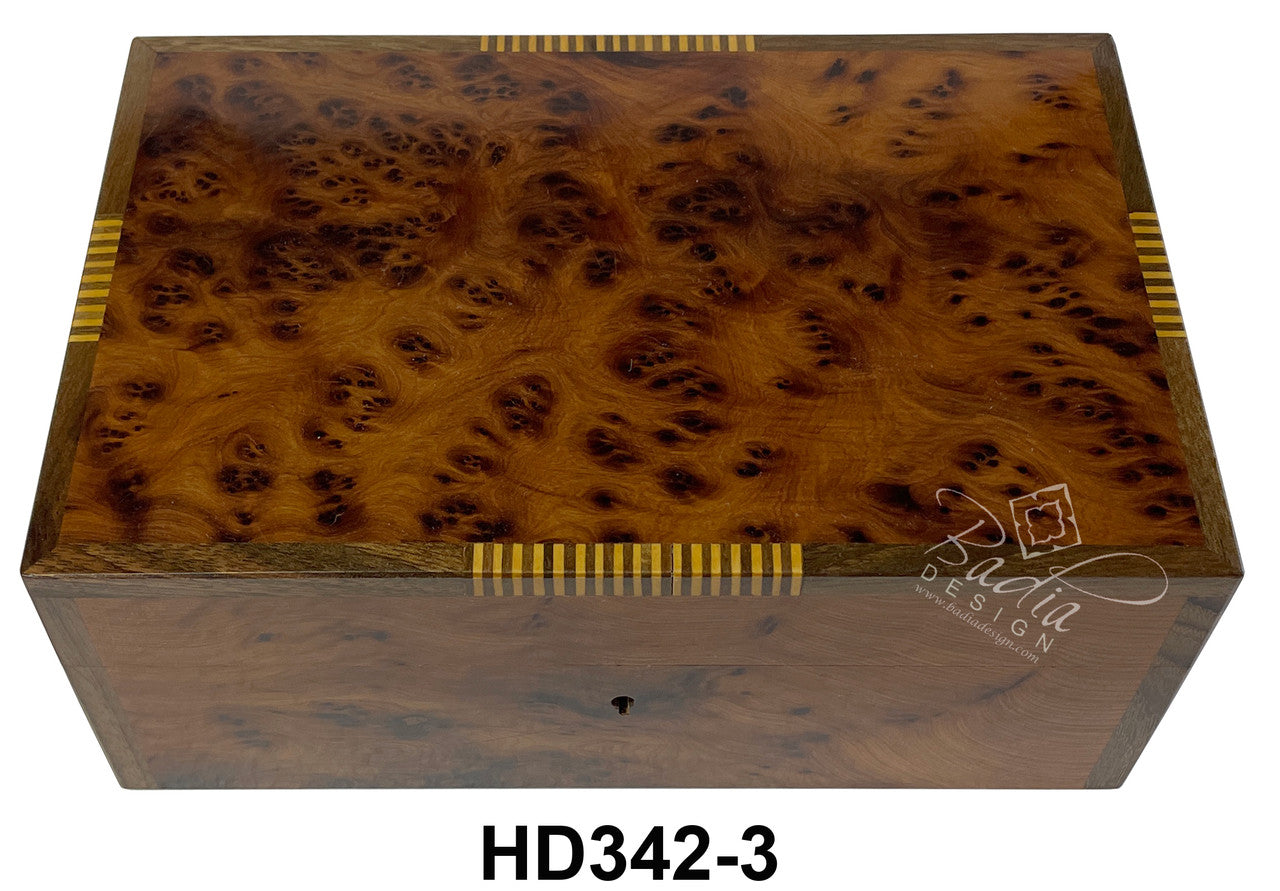 Wooden box with burl pattern and gold accents, featuring the brand &