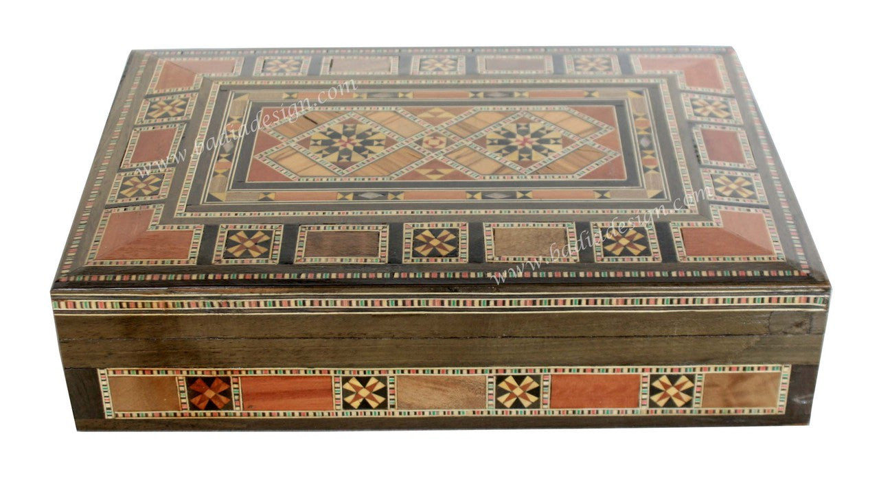 Decorative wooden box with intricate patterns on a white background